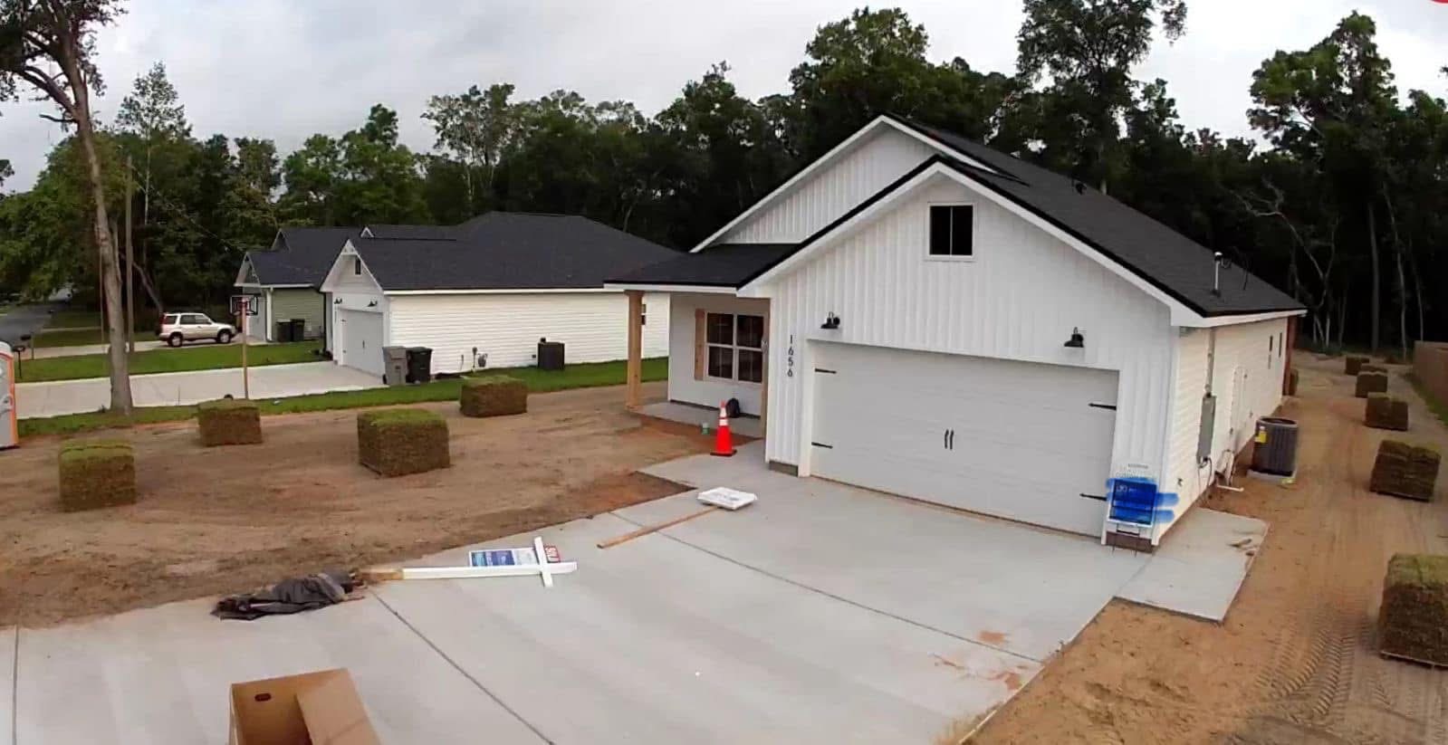 New construction home with sod pallets ready for install